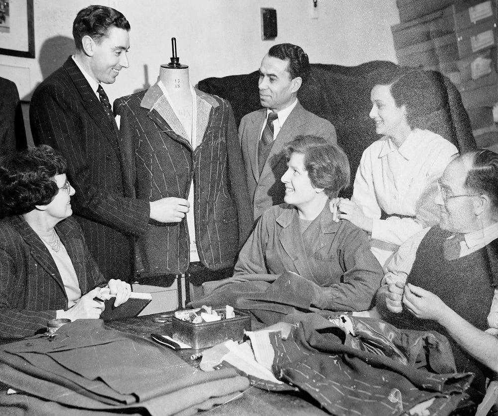 The firm’s reputation was based on the skill of George, Stanley and staff like tailoress Margaret Blythe (seen in the middle here in 1954), who worked at G Livingston & Son for 45 years until 1990.