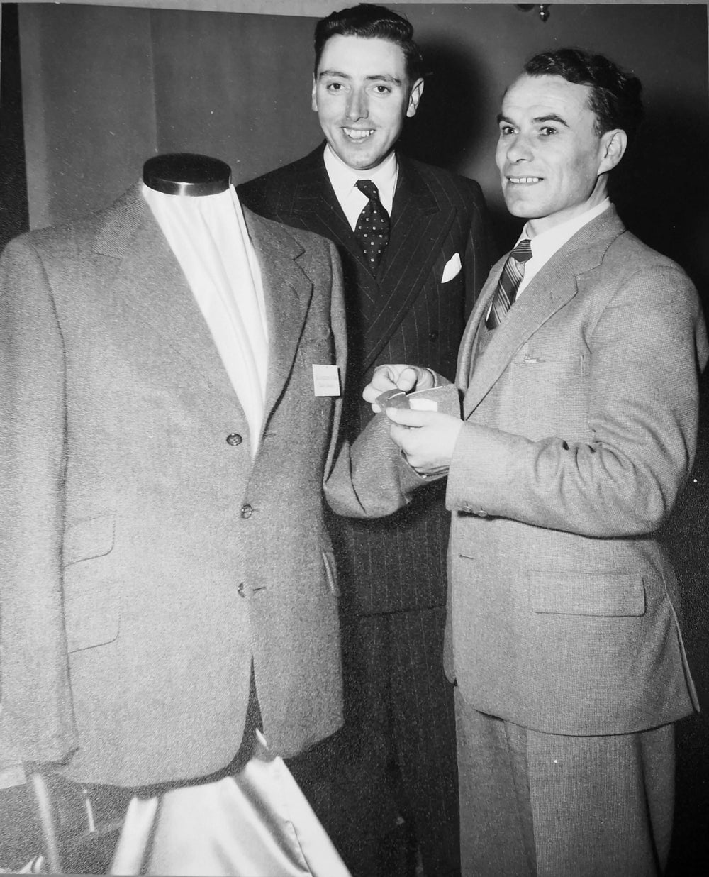 George is seen here with Stanley Sobcyzk and the winning jacket. George was also awarded a Silver Medal in 1954 for a pair of his trousers.
