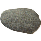 Magee Donegal Tweed Flat Cap in green herringbone, angled view