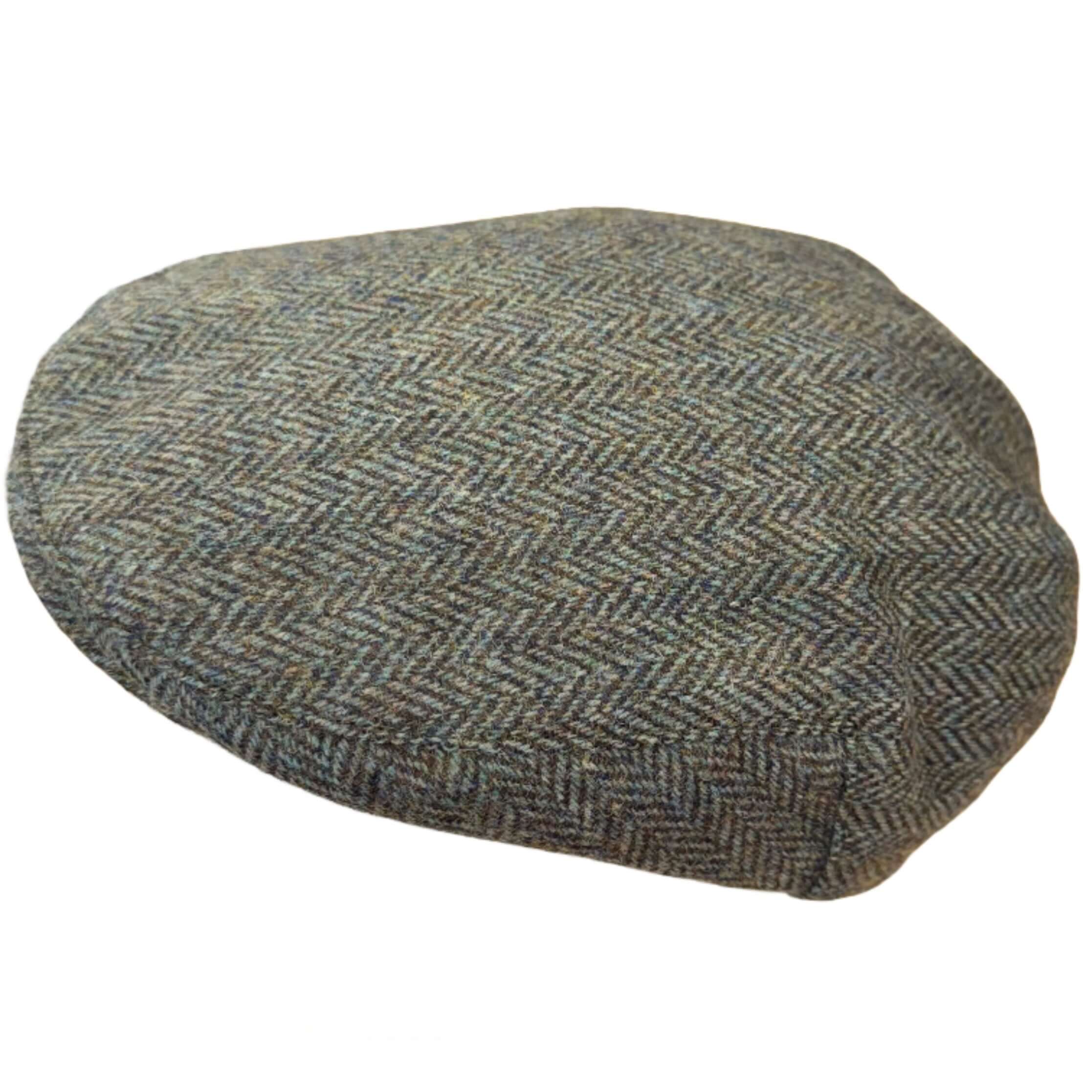 Magee Donegal Tweed Flat Cap in green herringbone, angled view