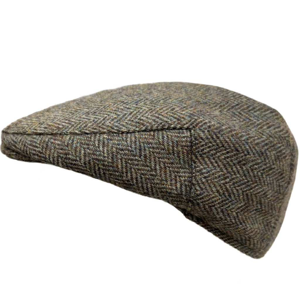 Magee Donegal Tweed Flat Cap in green herringbone, top view