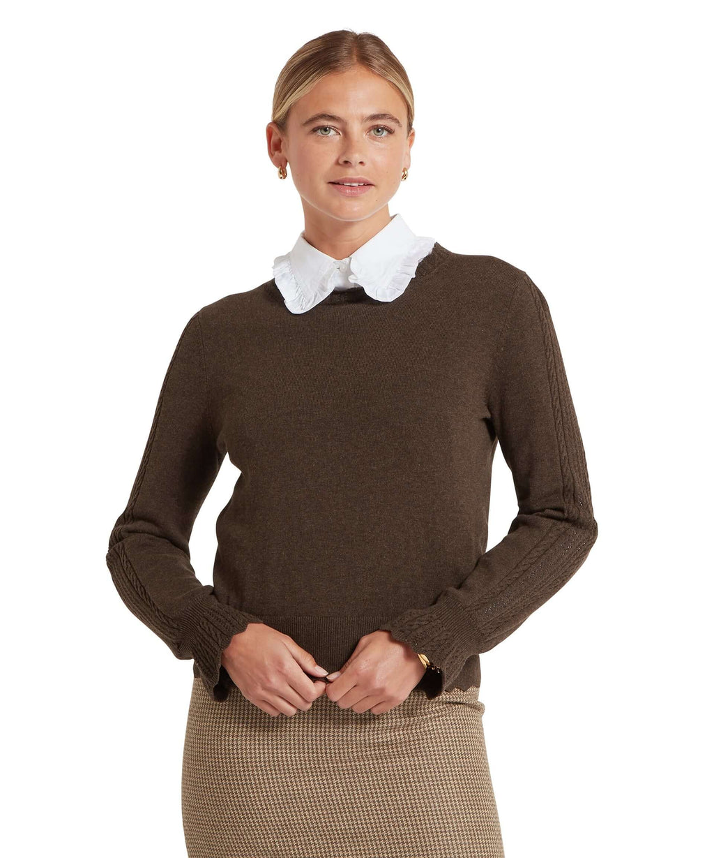 Leyburn Chocolate pointelle jumper worn by a model, front view